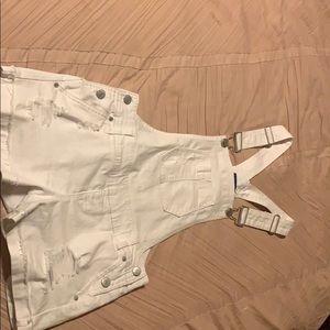 white ripped overalls